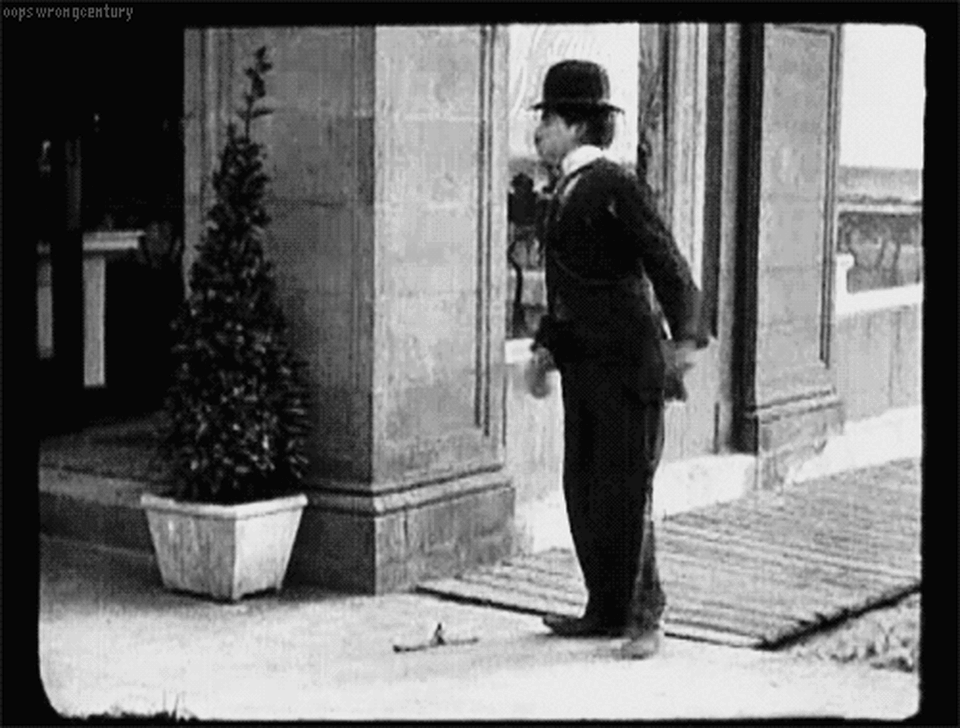 Charlie Chaplin slipping banana peel