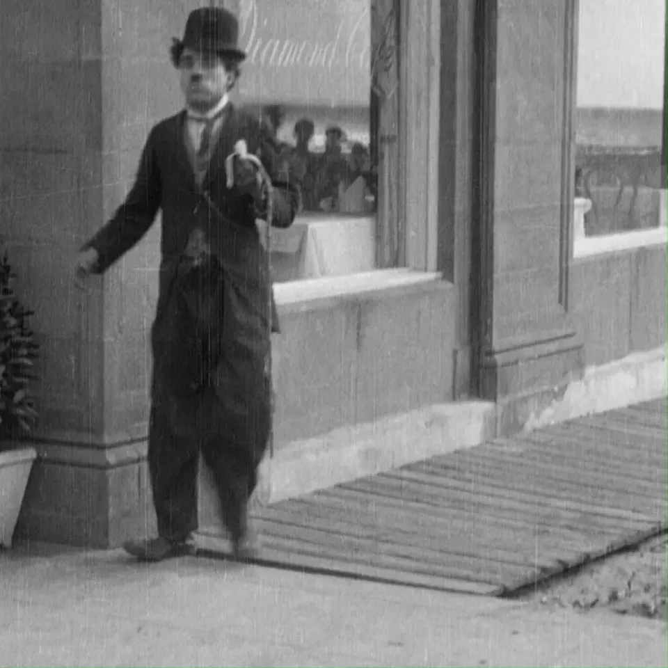 Charlie Chaplin slipping banana peel png
