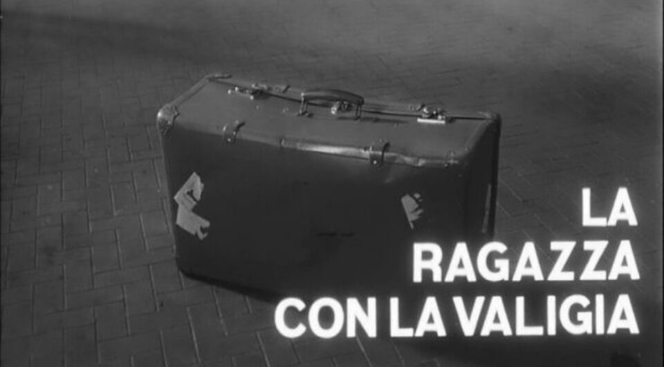 Girl with a suitcase title still